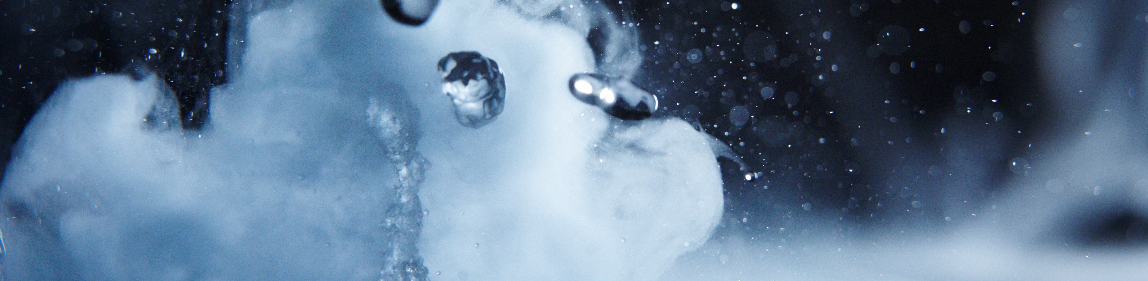 A stylistic photo of water droplets and steam